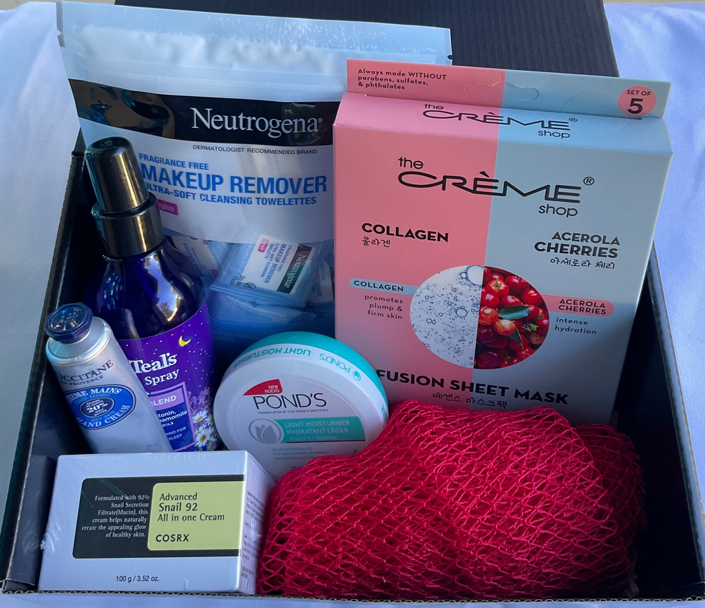 Open box containing skincare products including Neutrogena makeup remover and The Crème Shop sheet masks.
